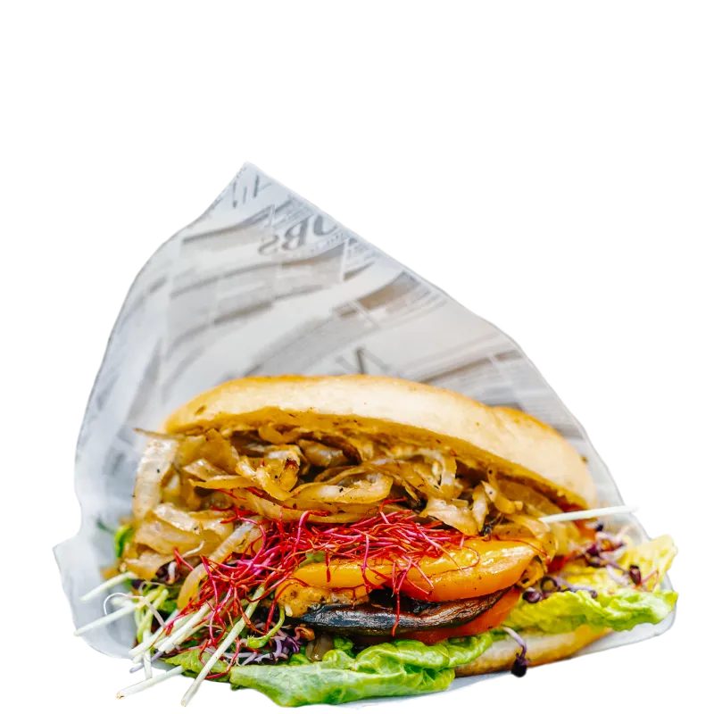 Foodliner Veggie-Burger mit gegrilltem Gemüse, karamellisierten Zwiebeln, frischen Sprossen und knackigem Salat – die perfekte fleischlose Alternative.